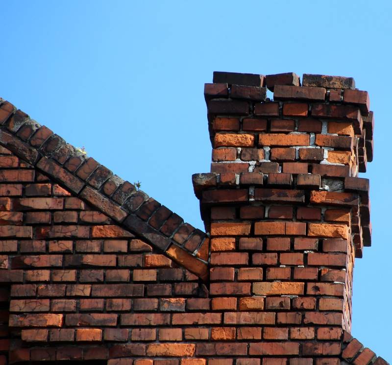 Damaged chimney on an Maywood home showing cracks and missing mortar